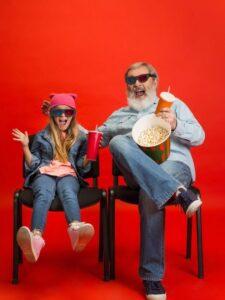 Senior man, grandfather having fun and spending time together with girl, granddaughter.